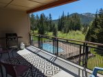 Propane grill and lounge chairs on back deck overlooking pool area and Mt. Hood Skibowl in the backdrop.